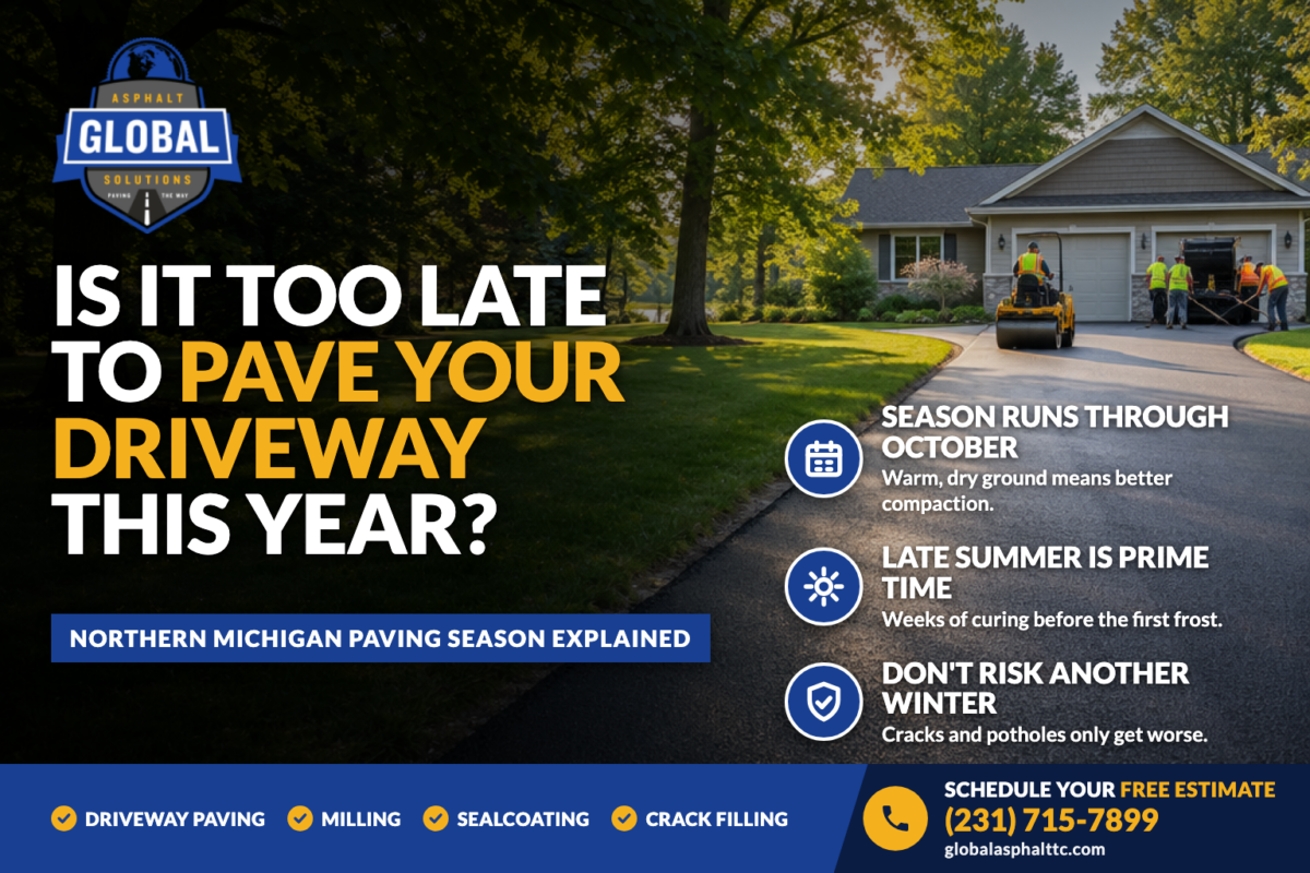 Freshly paved asphalt driveway at a Northern Michigan home with a paving crew at the garage, with the headline Is It Too Late to Pave Your Driveway This Year?